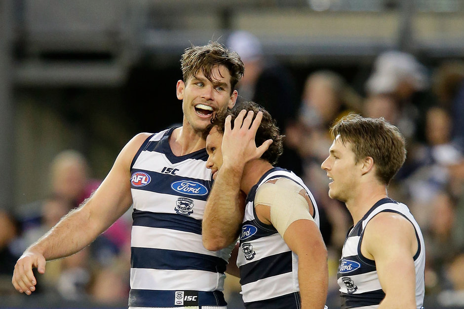AFL 2016 Rd 21 - Richmond v Geelong MELBOURNE, AUSTRALIA - AUGUST 14: Geelong Cats players celebrate a Tom Hawkins goal during the 2016 AFL Round 21 match between the Richmond Tigers and the Geelong Cats at the Melbourne Cricket Ground on August 14, 2016 in Melbourne, Australia. (Photo by Darrian Traynor/AFL Media)